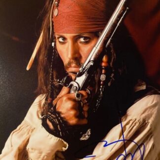 Johny Depp as Jack Sparrow in Pirates of the Caribbean signed 10" x 8" photo - with COA