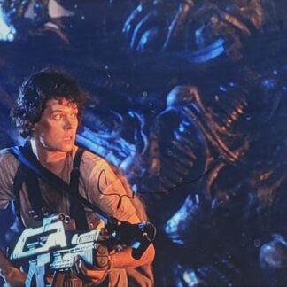 Sigourney Weaver as Ripley in Aliens - autographed photo 10" x 8" mounted to 17" x 17x5" - with COA